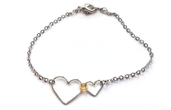 Large and small linked heart bracelet by Fiore Jewellery