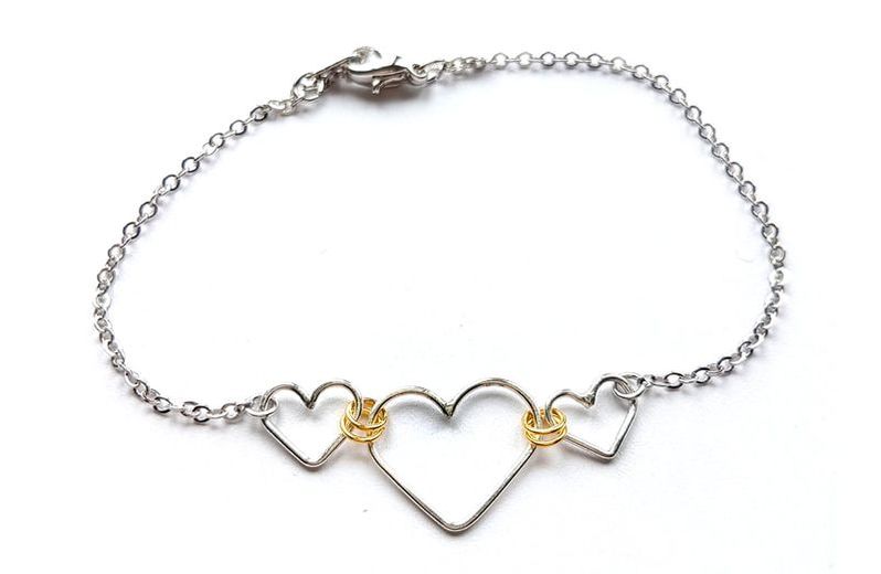 One large and two small linked heart bracelet by Fiore Jewellery